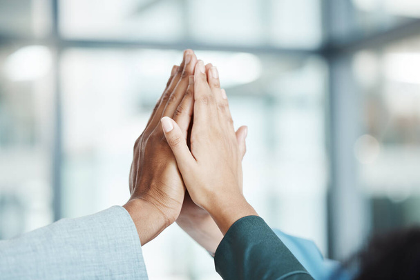 Hands, high five and motivation with a team working in collaboration together in the office. Team building, success and partnership with an employee group in celebration of reaching a target or goal. - Foto, Imagem