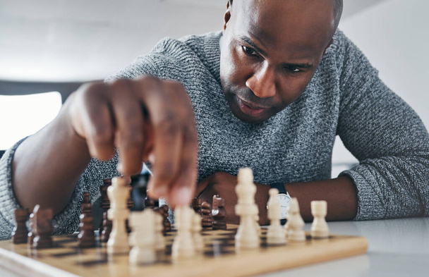 Always stay a move ahead of the game. a mature businessman playing chess in his office - Fotó, kép