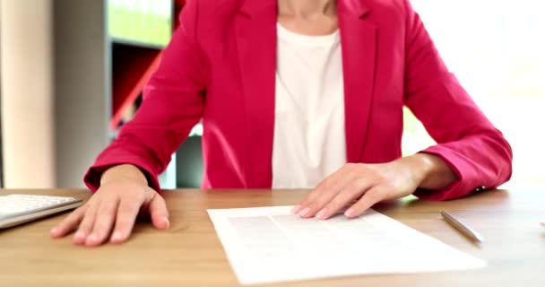 Businesswoman rejecting document for signing in office closeup 4k movie slow motion. Secure business transactions concept - Footage, Video