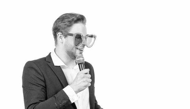 Master of ceremony. Emcee isolated on white. Emcee or conferencier in funny glasses. Speaker speak to microphone. Dedicated to speaking out, copy space. - Foto, immagini