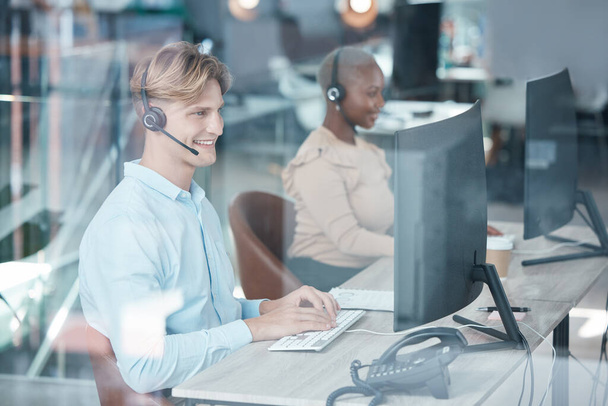 Call center, people and typing at computer desk for customer service consultant communication. Contact us, technical support or telemarketing with satisfied smile of workers online in office - 写真・画像