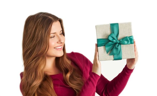Christmas holiday present, happy woman holding a gift or luxury beauty box subscription delivery isolated on white background, portrait - Φωτογραφία, εικόνα