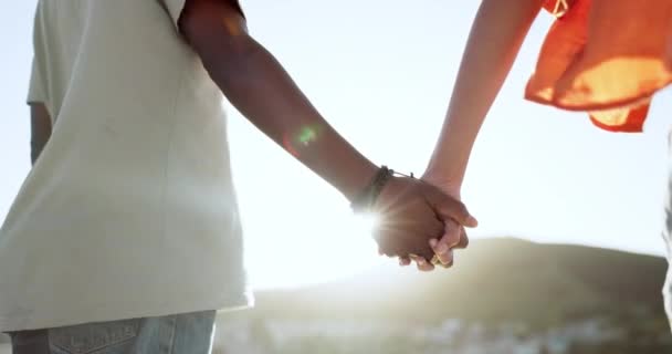 Interracial couple, bonding or holding hands in support, trust or security in Lisbon city, Portugal. Zoom, black man or woman in solidarity, love or unity on summer holiday vacation in relax location. - Footage, Video