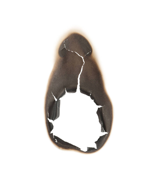 Burnt hole in paper on white background - Foto, imagen