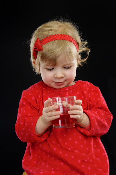 Little girl drinking juice, - Фото, зображення