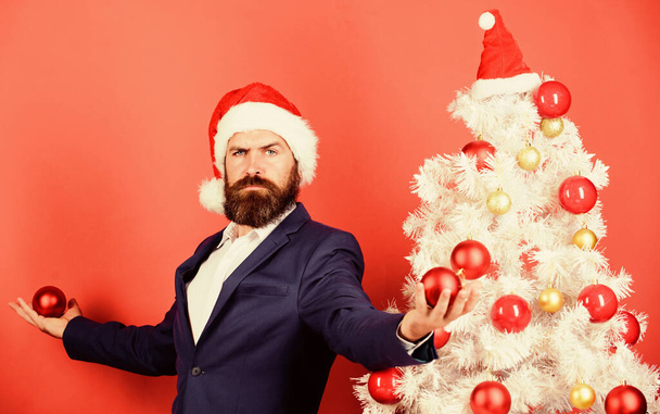 welcome home. happy holidays. winter season sales. merry christmas. bearded man santa hat hold xmas ball. magic creativity. white christmas. businessman decorate new year tree. man celebrate xmas. - 写真・画像