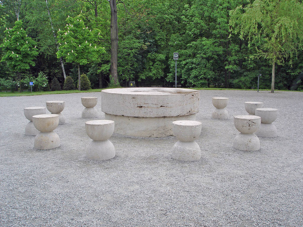 old stone chairs with table in the park - Photo, Image