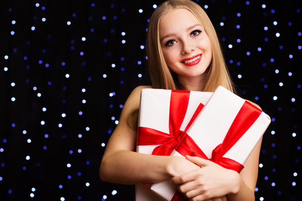 Beautiful teenager girl holding white gift box - Photo, Image