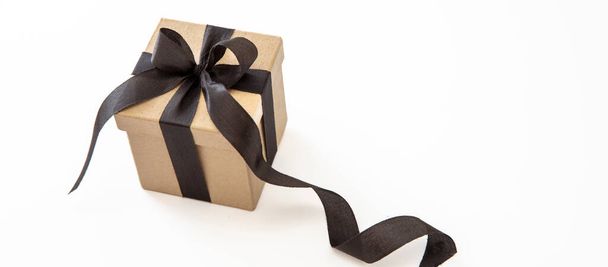 Gift box with black ribbon isolated against white background, Black Friday Sale and Christmas presents concept. - 写真・画像