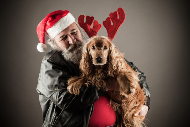 Badass Santa met hond  - Foto, afbeelding