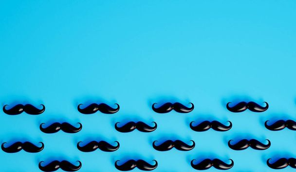 Moustache de fond. Beaucoup de moustaches mâles sur fond bleu. Rendu 3D. - Photo, image