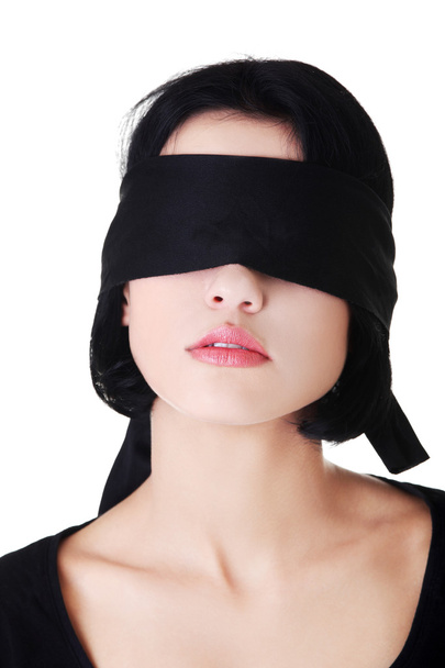 Serene woman with black band on eyes - Фото, изображение