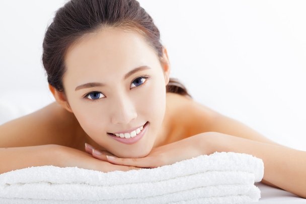 Young  woman getting spa treatment over white background - Foto, Imagen