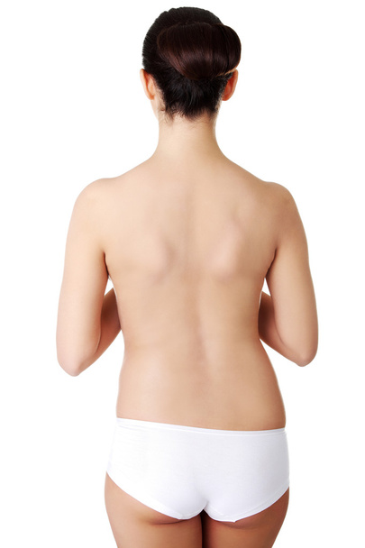 Back view slim topless woman in underwear - Фото, изображение