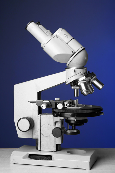 Microscope on table, on color background - Photo, Image