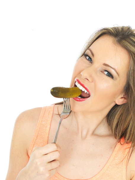 Young Woman Holding a Gherkin - Photo, image