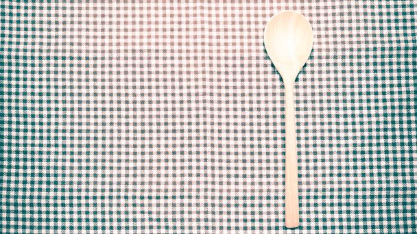 wood spoon on kitchen towel - Photo, Image