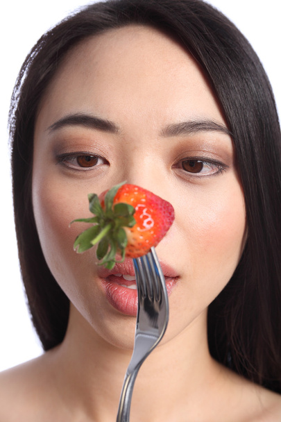 Strawberry eyes of beautiful young oriental girl - Photo, Image