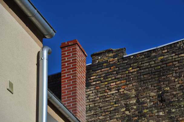 Old brick wall on a background of blue sky - Photo, Image