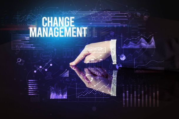 Businessman touching huge screen with CHANGE MANAGEMENT inscription, cyber business concept - Фото, зображення