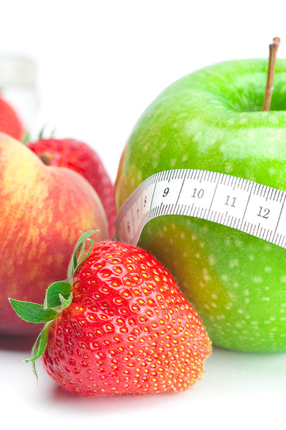 Big juicy red ripe strawberries,apple,peas,peach and measure tap - Photo, Image