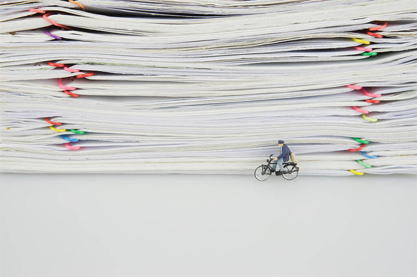 Stack of documents with colorful clips and miniature people - Photo, Image