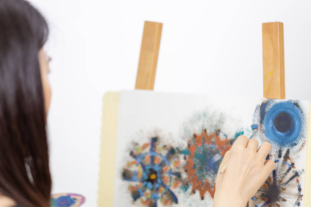 Artist painting on an easel - Photo, Image