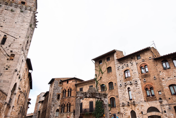 The medieval architecture of the ancient city of San Gimignano, Tuscany, Italy - 写真・画像
