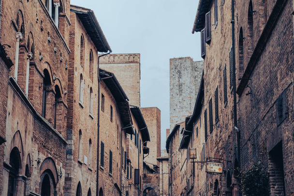 San Gimignano is a small walled medieval hill town in the province of Siena, Tuscany, north-central Italy. Known as the Town of Fine Towers. - Фото, изображение