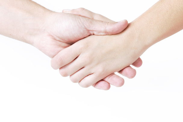 Man and woman shaking hands, isolated on white. Woman hand in fr - Foto, Bild