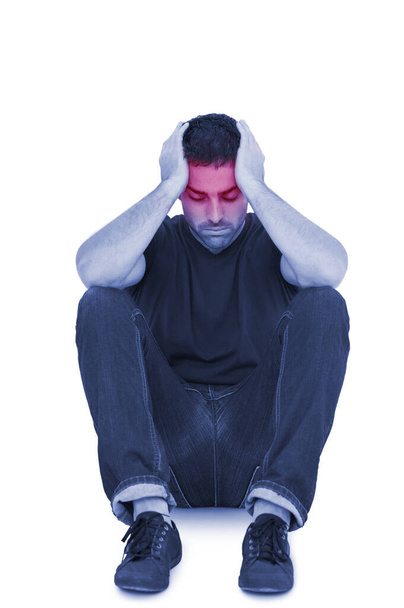 Сидячий засмучений чоловік з головою між руками
 - Фото, зображення