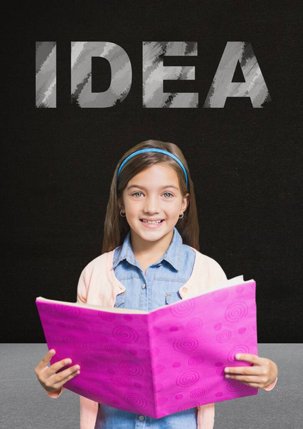 Idea text above girl reading on blackboard - Photo, Image