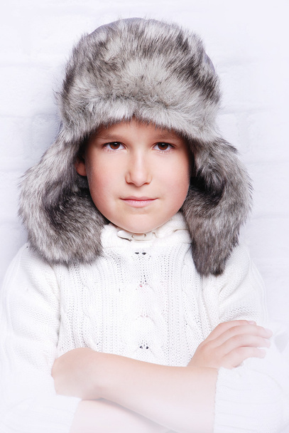 Smiling boy in warm fur hat - Zdjęcie, obraz