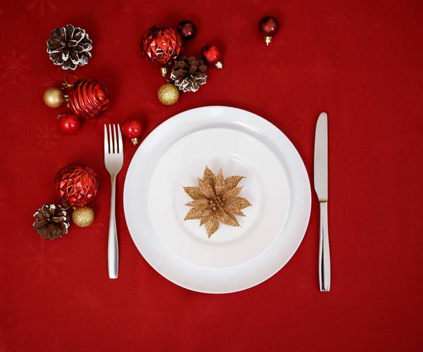 Christmas concept - top view of white ceramic plate with decoration - Photo, Image