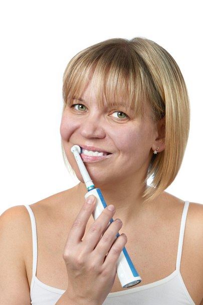 Happy woman brushing teeth and smiling isolated - Foto, Bild