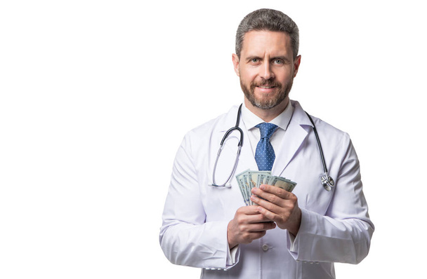 Happy doctor holding money. medical insurance. health insurance. Money for medical service. Medicare expenses. Healthcare fee, copy space. - 写真・画像