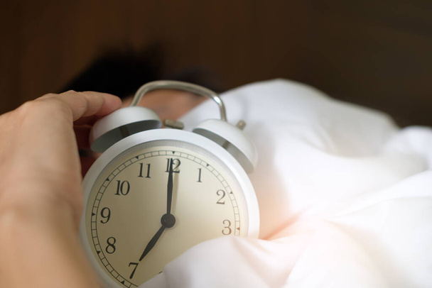 alarm clock near bed, close up view - Photo, Image
