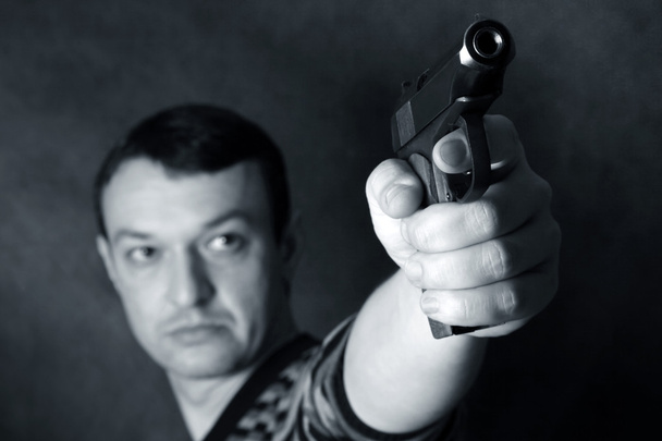 Man with a pistol - Foto, afbeelding