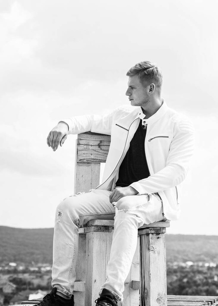 young confident guy in white urban clothes outdoor, fashion. - Foto, Bild