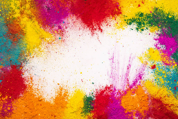 Colorful holi powder explosion isolated on white wallpaper background. - Photo, Image