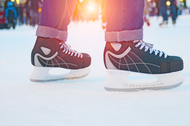 Ice skater on the rink at sunset - Fotoğraf, Görsel