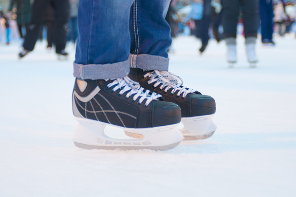 Legs of skater on winter ice rink - Foto, Imagem