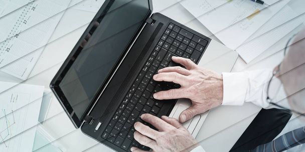 Top view of businessman typing on laptop keyboard, geometric pattern - Foto, Imagen
