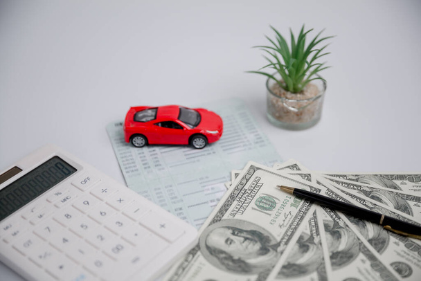 Concept of car insurance business, saving buy - sale with tax and loan for new car. Car toy vehicle with stack coin money on background. Planning to manage transportation finance costs. loan for car - Foto, immagini