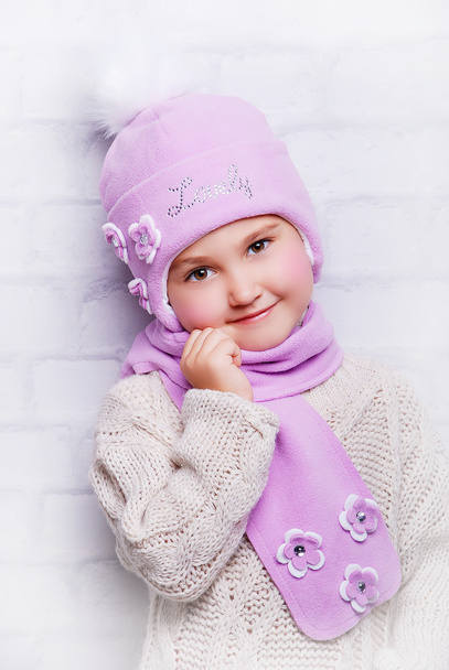 Smiling girl in warm hat - Photo, Image