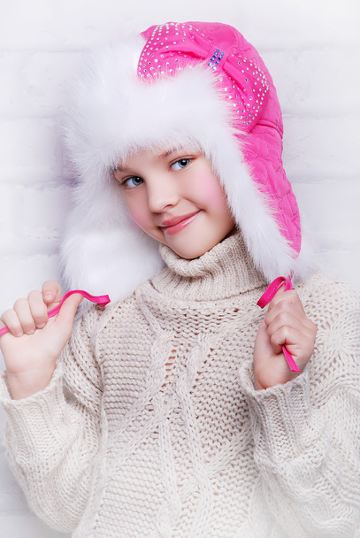 Smiling girl in warm winter hat - Фото, изображение