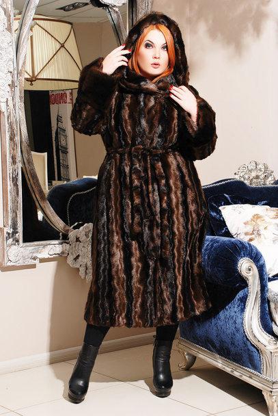 Plus size woman in winter fur coat - Fotó, kép