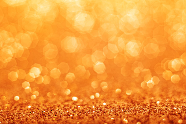 Gold defocused glitter background with copy space. - Foto, imagen