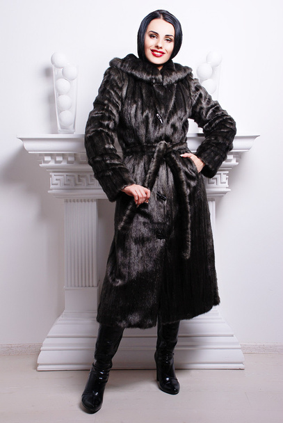 brunette woman in trendy fur coat - Photo, Image