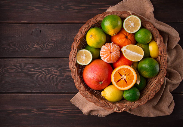 Assortment, citrus fruits, in a basket, close-up, top view, no people, - Valokuva, kuva